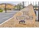 Stone sign marking the entrance to 'The Cottages' community at 6739 Twisted Wood Dr, Las Vegas, NV 89148