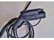 Detailed view of the Emporia EV charger plug, highlighting its design and functionality at 6739 Twisted Wood Dr, Las Vegas, NV 89148