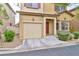 Inviting exterior showcasing a well-maintained front yard, warm exterior tones and attached garage at 6739 Twisted Wood Dr, Las Vegas, NV 89148