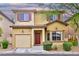 Charming two-story home showcasing a well-maintained front yard, warm exterior tones and inviting curb appeal at 6739 Twisted Wood Dr, Las Vegas, NV 89148