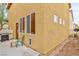 Rear view of the home highlighting the patio and windows at 6739 Twisted Wood Dr, Las Vegas, NV 89148