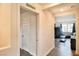 Hallway with wood floors leads to a naturally lit living room with neutral color scheme at 6739 Twisted Wood Dr, Las Vegas, NV 89148