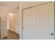 This hallway features white doors and wooden floors throughout the home at 6739 Twisted Wood Dr, Las Vegas, NV 89148