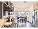 A bright kitchen features stainless steel appliances and a cozy dining area with natural light at 6739 Twisted Wood Dr, Las Vegas, NV 89148