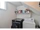 A well-organized laundry area with modern appliances offers convenient laundry solutions at 6739 Twisted Wood Dr, Las Vegas, NV 89148