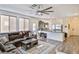 Spacious living room with modern decor, lots of seating, and great natural light throughout the house at 6739 Twisted Wood Dr, Las Vegas, NV 89148