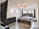 Upstairs main bedroom with hardwood-style floors and large windows at 6739 Twisted Wood Dr, Las Vegas, NV 89148