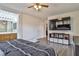 Spacious main bedroom includes an adjacent bathroom and a television at 6739 Twisted Wood Dr, Las Vegas, NV 89148