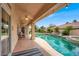 Beautiful pool and patio area with tropical landscaping, perfect for outdoor relaxation and entertainment at 7511 Bridlehorne Ave, Las Vegas, NV 89131
