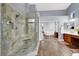 Bright bathroom with spacious walk-in shower, double vanity and large mirror at 7511 Bridlehorne Ave, Las Vegas, NV 89131