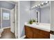 Bathroom featuring wood floors, double doors, and white countertops at 7511 Bridlehorne Ave, Las Vegas, NV 89131