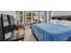 Bedroom featuring large windows, a bed, and exercise equipment at 7511 Bridlehorne Ave, Las Vegas, NV 89131