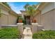 View of the private courtyard with a decorative iron gate and manicured landscaping at 7511 Bridlehorne Ave, Las Vegas, NV 89131