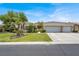 Charming home with a three-car garage and well-manicured lawn at 7511 Bridlehorne Ave, Las Vegas, NV 89131