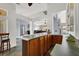 Open kitchen featuring a countertop bar with wood cabinetry and open view to living area at 7511 Bridlehorne Ave, Las Vegas, NV 89131