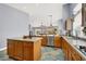 Open kitchen with a center island, modern appliances, and ample counter space, ideal for culinary enthusiasts at 7511 Bridlehorne Ave, Las Vegas, NV 89131
