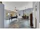 Spacious living area with a pool table, dining table, large windows, and custom tile flooring at 7511 Bridlehorne Ave, Las Vegas, NV 89131