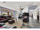 Spacious living room with a fireplace, high ceilings, and views of the backyard at 7511 Bridlehorne Ave, Las Vegas, NV 89131