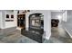 Living room showcasing a fireplace, custom tile flooring, and comfortable leather seating at 7511 Bridlehorne Ave, Las Vegas, NV 89131