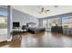 Open main bedroom with wood floors, an ensuite bathroom, and large windows, offering a relaxing retreat at 7511 Bridlehorne Ave, Las Vegas, NV 89131
