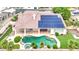 Aerial view of the backyard showcasing a private pool, spa, solar panels, and a covered patio at 7511 Bridlehorne Ave, Las Vegas, NV 89131