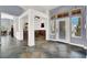 Open-concept wet bar area with seating, cabinetry, and an entrance to the front patio at 7511 Bridlehorne Ave, Las Vegas, NV 89131