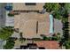 Aerial view of a residence showcasing a tiled roof, solar panels and landscaping in a well-maintained community at 7625 Raven Hills Dr, Las Vegas, NV 89149