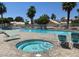 A pristine community pool with a connected jacuzzi at 7625 Raven Hills Dr, Las Vegas, NV 89149