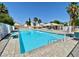 Large community pool with chairs and shade at 7625 Raven Hills Dr, Las Vegas, NV 89149