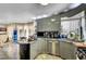Modern kitchen featuring stainless steel appliances, a curved countertop, and unique cabinetry at 7625 Raven Hills Dr, Las Vegas, NV 89149