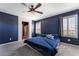 Well-lit bedroom with carpet, complemented by shuttered windows and an attached bathroom for convenience at 7732 Bandon Cliffs St, North Las Vegas, NV 89084