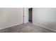 Neutral bedroom with gray carpet and white doors for closets and ensuite at 7732 Bandon Cliffs St, North Las Vegas, NV 89084