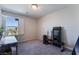Well-lit bedroom featuring a window with bright natural light and gray carpet at 7732 Bandon Cliffs St, North Las Vegas, NV 89084