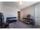 Bonus room featuring a desk, carpet floors, and potential for a home office or creative space at 7732 Bandon Cliffs St, North Las Vegas, NV 89084
