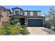 Two-story home with a two-car garage and well-manicured landscaping at 7732 Bandon Cliffs St, North Las Vegas, NV 89084