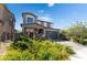 Charming two-story home with landscaped yard and brick driveway at 7732 Bandon Cliffs St, North Las Vegas, NV 89084