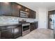 Kitchen features stainless appliances and granite countertops at 7732 Bandon Cliffs St, North Las Vegas, NV 89084