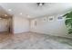 Spacious living room with tile floors, recessed lighting and modern ceiling fan at 7732 Bandon Cliffs St, North Las Vegas, NV 89084