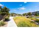 Beautiful community park with lush greenery, sidewalk, and inviting gazebo, a perfect neighborhood gathering spot at 7732 Bandon Cliffs St, North Las Vegas, NV 89084