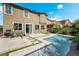 Stunning backyard featuring a sparkling pool, patio and lush landscaping creating a private oasis at 7732 Bandon Cliffs St, North Las Vegas, NV 89084