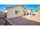 Enclosed backyard with gravel and covered patio offering a private outdoor area at 7801 Olympus Ave, Las Vegas, NV 89131