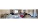 Spacious bedroom showcasing comfortable beds, bright window, and a decorative painting at 7801 Olympus Ave, Las Vegas, NV 89131