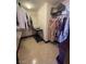 Walk-in closet with ample hanging space and shelving for organization, neat and well-maintained at 7801 Olympus Ave, Las Vegas, NV 89131
