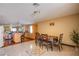 Dining area with a view of the kitchen, complete with a table and chairs at 7801 Olympus Ave, Las Vegas, NV 89131