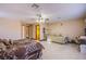 Expansive main bedroom with two beds, tile flooring, and a ceiling fan at 7801 Olympus Ave, Las Vegas, NV 89131