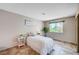 Bright bedroom with a cozy bed and views of the outdoor area at 7952 Diamond Rock Way # 102, Las Vegas, NV 89128