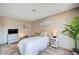 Comfortable bedroom featuring tile floors, soft lighting, and a dresser at 7952 Diamond Rock Way # 102, Las Vegas, NV 89128