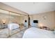 Bright bedroom with dresser and closet providing extra storage space at 7952 Diamond Rock Way # 102, Las Vegas, NV 89128