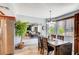 Inviting dining area complemented by a stainless steel refrigerator and leafy green plant at 7952 Diamond Rock Way # 102, Las Vegas, NV 89128