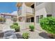 Attractive condominium building with well-maintained landscaping, complemented by a walkway and manicured shrubs at 7952 Diamond Rock Way # 102, Las Vegas, NV 89128